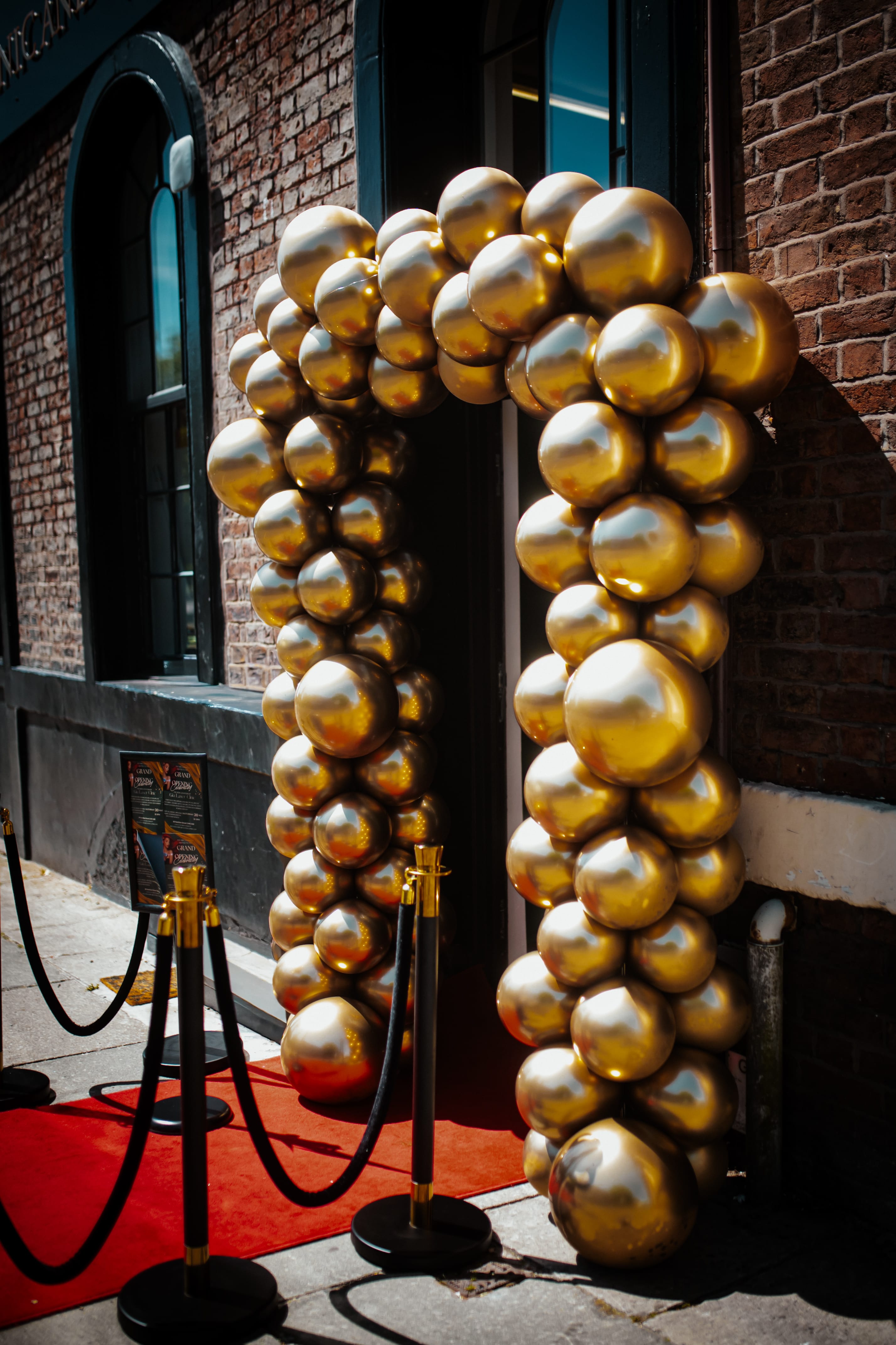 The gold balloon arch and red-carpet entrance