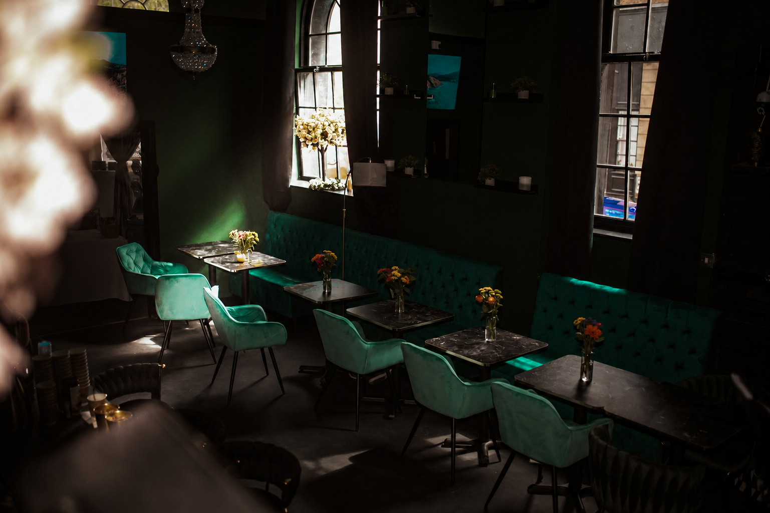 The emerald-and-gold lounge at House of Beauty by Gia